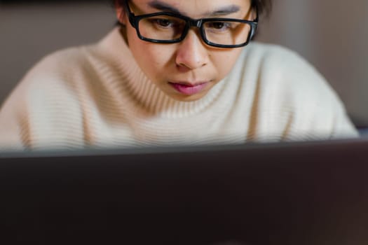 Busy businesswoman working on laptop computer in office. Confident young woman in casual clothes using laptop while working at home.