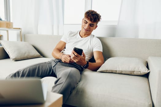 man interior modern adult mockup text smart home sofa lifestyle sitting communication smile freelancer