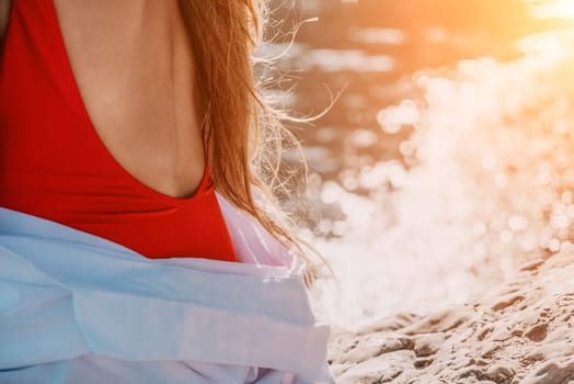 Sexy young woman in stylish bikini lying on seashore, closeup. Holiday, vacation and recreational concept.