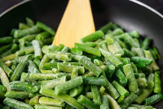 Frozen green beans. Selective focus. Healthy nutrition. Frozen beans vitamins