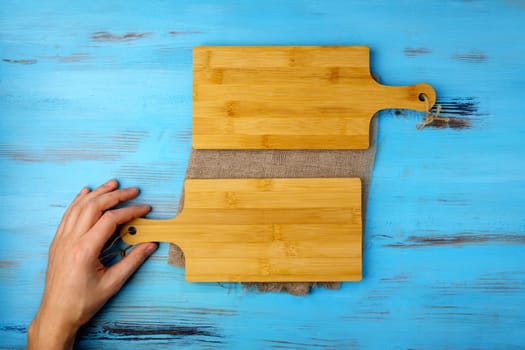 Empty two cutting board on the boards of the food background concept. Copy space, top view