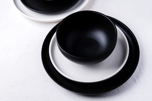 Black and white ceramic dishes and tableware. Tableware. Set of plates.