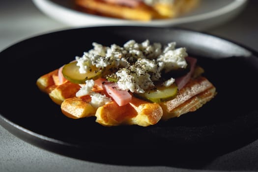 Appetizing pizza waffle with ham, pickles and cheese. Hybrid trending food