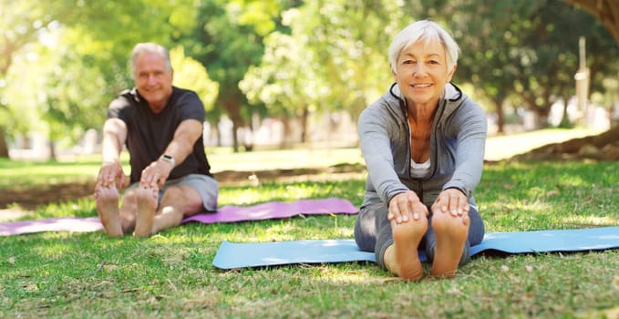 Portrait, yoga and senior couple in a park, meditation and exercise with sunshine, balance or wellness. Face, mature man or old woman with workout, fitness and outdoor with retirement and performance.