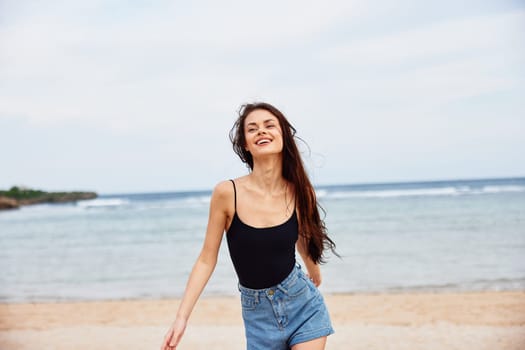 woman leisure carefree running lifestyle young water beach smiling sunset travel summer ocean sea relax active tan body sand fun smile