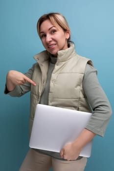 young blond hair business woman with a laptop in her hands in the office.