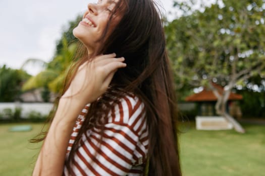 smiling woman sunset carefree park nature happiness beauty freedom beautiful wellness summer sunny face active outdoor portrait lifestyle t-shirt sun walk