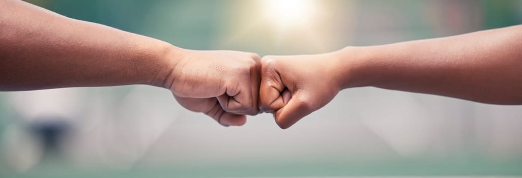 Closeup, fist bump and sport for success, motivation or teamwork together with lens flare while outdoor. Tennis player, friends and hands touch for support, team building or sports at summer training.