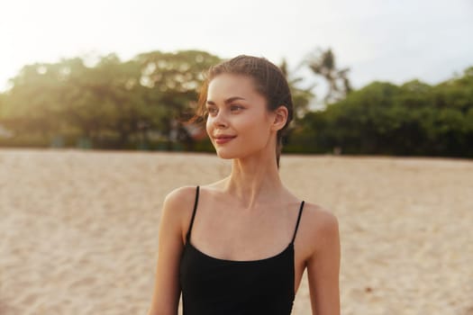 female woman sunset copy vacation jean happiness summer sky outdoor smile sand coast water running beach sun space girl sea lifestyle ocean