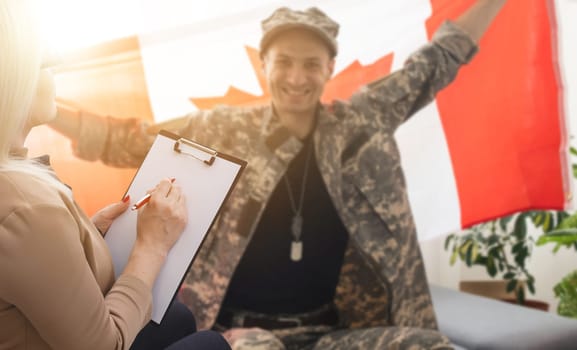 with the flag of Canada, a soldier at a psychologist.