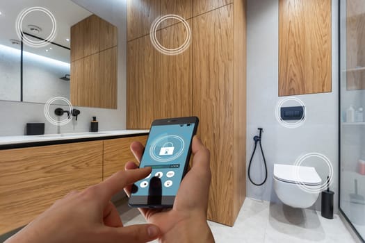 Close up smartphone in female hand with smart home system app interface on cellphone screen, young woman controlling all house system by phone in modern apartment, internet of things concept