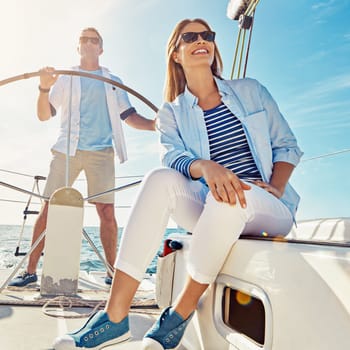 Vacation, boat and sea with couple on adventure for travel to freedom in the summer with sunshine. Holiday, yacht and transport people together on luxury ocean journey to relax during journey