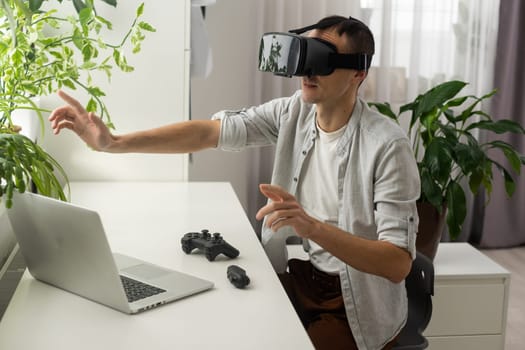 Man wearing virtual reality goggles. Studio shot.