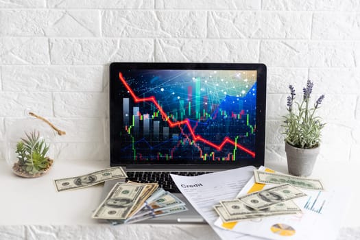 Investor analyze stock chart with laptop, businessman forecast and analysis graph in Bearish downtrend, economic slowdown, inflation crisis, loan interest rise, trade war finance