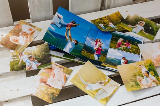 Family photos archive saved in brightly designed photo book; bright summer memories placed in the photobook