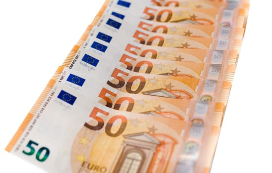 50 Euro banknotes in pattern over white background. Euro banknote as part of the economic and trading system. Close-up