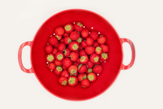 Strawberry in a red plate top view
