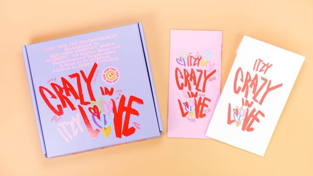 K-pop group Itzy CRAZY IN LOVE 1st Album on yellow background. Special edition music CD. South Korean girl group Itzy. Space for text. Gatineau, QC Canada - March 10 2023.