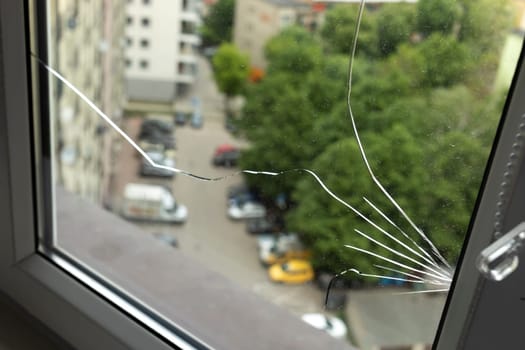 Crack, Broken Glass In A Double-glazed Window Due To Manufacturing Defect In Building, Home. Guarantee Manufacturer's Defective Products. Warranty. Horizontal Plane. Closeup. High quality photo