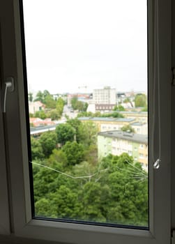 Crack, Broken Glass In A Double-glazed Window Due To Manufacturing Defect Or Temperature Difference In Building, Home. Manufacturer's Defect, Defective Products. Vertical Plane. Closeup