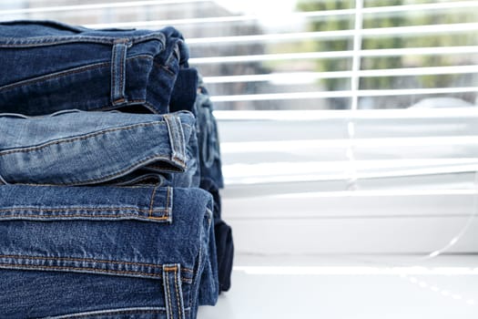 torn jeans stack background blue denim fashion beauty