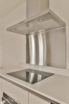 a modern kitchen with stainless steel hoods and appliances on the counter top in this image is taken from above