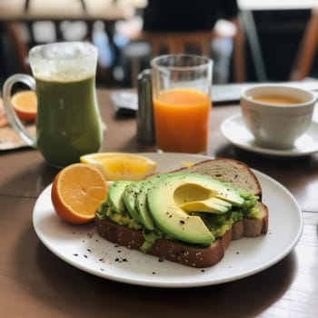 Tasty breakfast with avocado tiast and orange juice . High quality photo