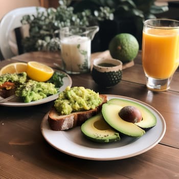 Tasty breakfast with avocado tiast and orange juice . High quality photo