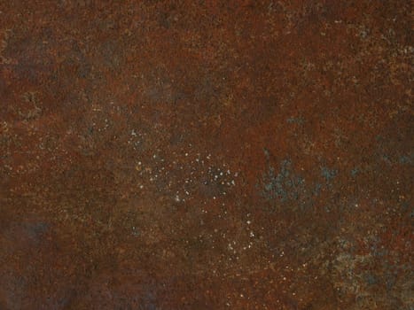 Corrosion. Metal plate with weathered colors and rust. Natural light. Blue and orange metal plate. Old oxidized colorful textured surface. Abstract grunge rusty metallic background for multiple uses