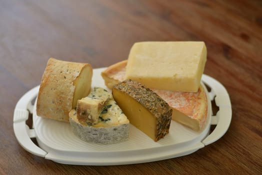 Cheese white platter with different french cheese
