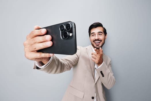 man phone space background white business smartphone suit gray copy portrait hold entrepreneur technology happy application cellphone success smile mobile phone call cell