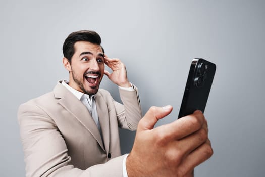 business man cell businessman phone copy hold guy entrepreneur mobile handsome portrait studio message smartphone phone space trading call app suit happy smile