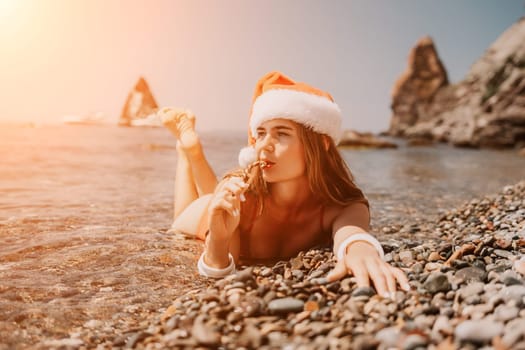 Woman travel sea. Happy tourist taking picture outdoors for memories. Woman traveler looks at the edge of the cliff on the sea bay of mountains, sharing travel adventure journey.