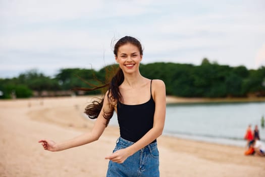 woman walking shore sunset beauty young leisure sea running beautiful hair travel beach person fun happy lifestyle active vacation summer smile