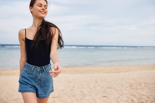 happy woman beach running sunset smile sand sea long beautiful nature tan body travel young hair relax leisure lifestyle summer water activity