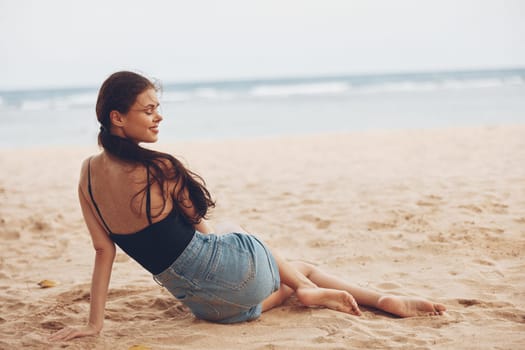 woman young nature sand smile back beach sun alone freedom travel sitting bali relax vacation body view sea coast girl ocean outdoor