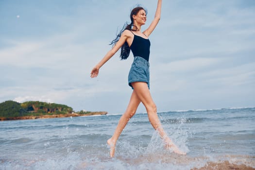 beach woman sea beauty smiling walking summer sunset ocean smile body travel running active positive flight lifestyle young shore relax activity