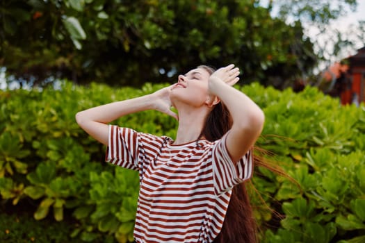 woman striped summer walk fun health smiling care park person face happiness freedom lifestyle t-shirt wellness sunny beautiful girl young nature joy