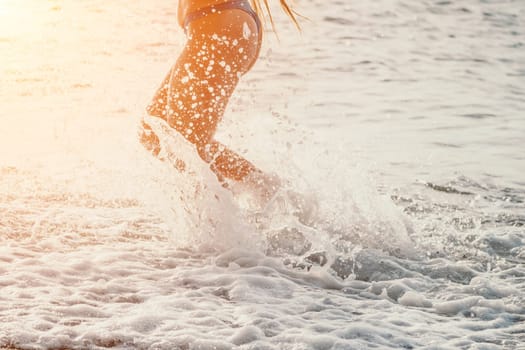 Running woman. Female runner jogging during the sunrise on beach. Woman Runner feet running on the beach at sunrise. woman fitness sunrise jog workout wellness concept.