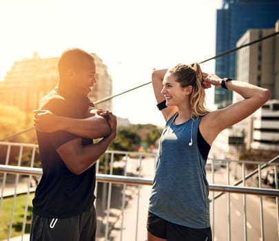 Surround you with people who make you a better person. two sporty young people warming up before a run