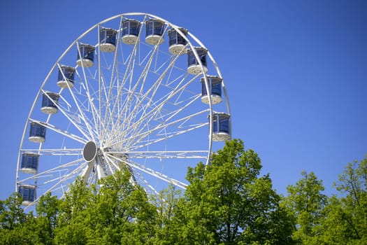 Ferris Wheel Over Blue Sky. High quality photo