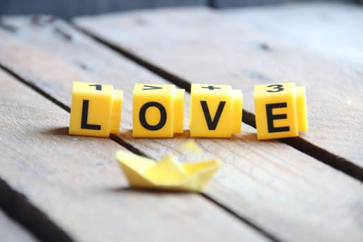 love concept. Greeting card with text on wooden background