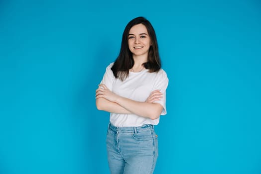 Successful Businesswoman in Casual Attire - Confident Female Office Manager with Crossed Arms - Isolated on Blue Background - Ideal for Corporate, Career, and Professional Concepts.