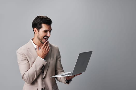 man computer notebook business typing corporate smile network copyspace wireless job working suit freelancer internet guy digital office laptop happy smiling