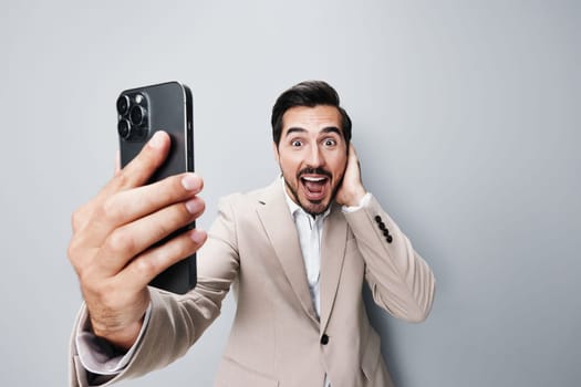 man cell smartphone business businessman online portrait phone space selfies internet smile handsome hold happy gray app call suit success copy holding