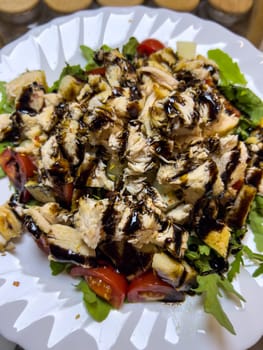 Salad with chicken breast, fresh tomatoes and green basil. High quality photo