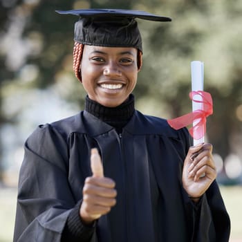 Portrait, black woman and thumbs up for graduation, education and success with degree. African American female, hand or student with scholarship, graduate and diploma with achievement, goal and smile.