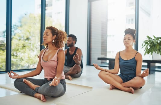 Shot of a group of people doing yoga.