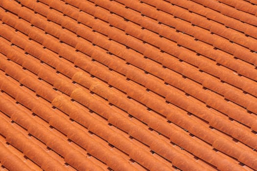 Close-up of new clay ceramic roof tiles on a building.