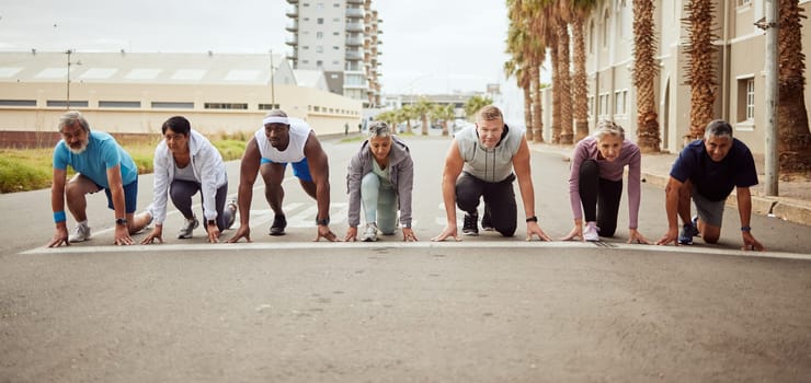 Start, fitness or people in a city marathon race with performance goals in workout or runners exercise. Motivation, focus or healthy group of senior athletes ready for running contest on street road.